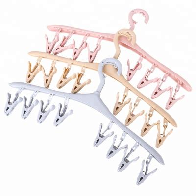 China Modern Multifunctional Plastic Hangers Clips with 8 Pegs Hanger for Socks Adults Kids Hat Bra Foldable Dryer for sale