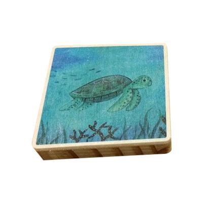 China Adjustable Wooden Cell Phone Holder Mirror Ocean Sea Turtle For Phone Charging for sale