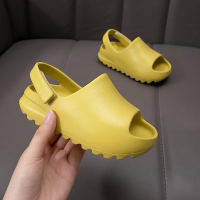 China Fashion trend colorful Yeezy inspired kids slides yezzy sandals slides with strap for boys outdoor slides for sale