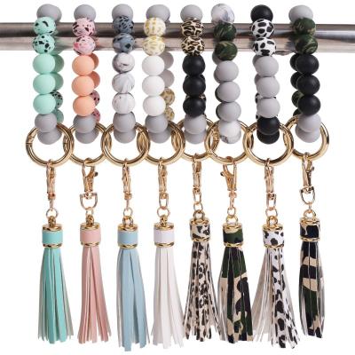 China Portable Keys Ring Holder Car Room Ring Bracelet Beaded Wrislet Keychain Silicone Key Holder for sale