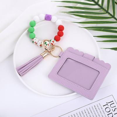 China Wholesale Silicone Key Beaded Bracelet Key Chain Holder PU Tassel Wallet Wristband Car Leather Keychain for sale