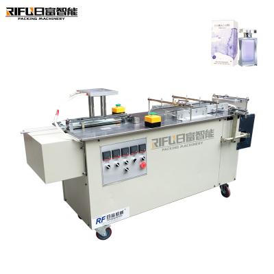 China Semi-automatic candy box self-heating hot pot film three-dimensional packaging machine for sale