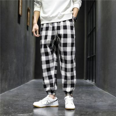 China 2021 Breathable spring and autumn Korean style loose pants fashionable men's sports casual plaid pants for sale