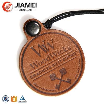 China Viable Custom Wholesale Free Round Garment Embossed Leather Embossed Design Tags for sale