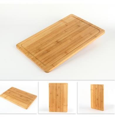 China Sustainable Wholesale Natural Organic Bamboo Food Cutting Board Wooden Chopper Blocks With Juice Groove for sale