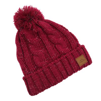 China JOINT Warm And Soft Custom Jacquard Cable Knit Beanie Toque Hats With Tassels for sale