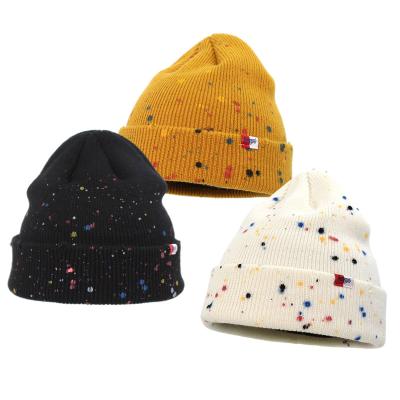 China Popular Wholesale COMMON Dots Men Winter Hat Knitted Cuff Toque Spray Paint Beanie for sale