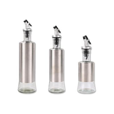 China Hot Selling Steamable Oil Dispenser Glass Bottle With Stainless Steel And Dispensing Bottle for sale