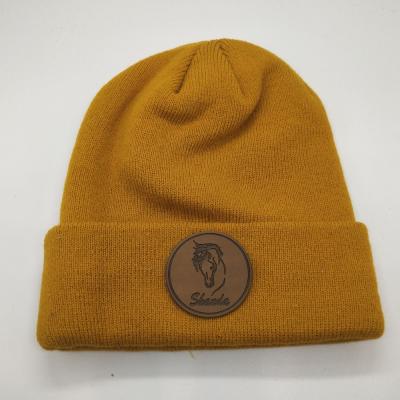 China JOINT Adults Warm Knit Soft Touch Acrylic Winter Patch Skull Beanie Custom Leather Hat for sale