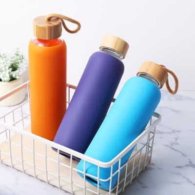 China Sustainable Wholesale High Borosilicate With Silicone Cover Bamboo Lid And Glass Straw for sale