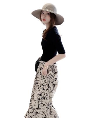 China Breathable bilateral pockets with black and white elastic fluffy knee length small waist flowers half-length skirt for summer for sale