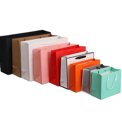 China Recyclable Custom White Paper Apparel Handbag Bag Card Stand Up Packaging Clothing Recyclable With Your Logo for sale