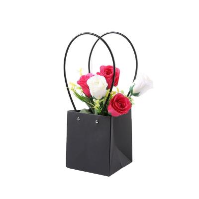 China Recycled Materials Waterproof Flat Trapeze Bag Flower Basket Boutique Box Kraft Paper Gift Flower Paper Bag With PVC Hand Rope for sale