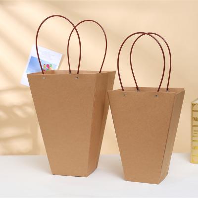 China Recyclable Fashionable Square Strong Exquisite Paper Bag Bottom Kraft Paper Basket Bag With Plastic Rivet Tube Handle for sale