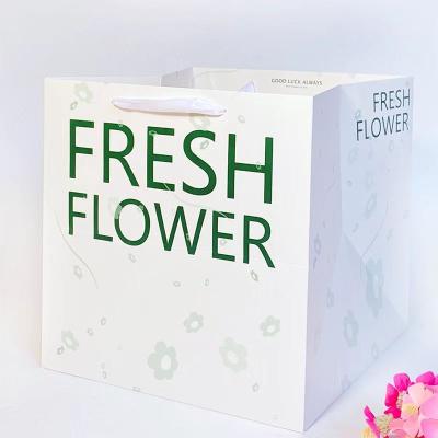 China Recyclable Custom Logo Print Wholesale Grocery White Board Paper Gift Bag Square Bottom With Handle for sale