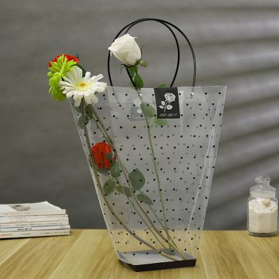 China Factory Direct Selling Flower Fashion Flower Wrapping Handbag Plastic Transparent Wave Point Trapeze Handbag Stalls for sale