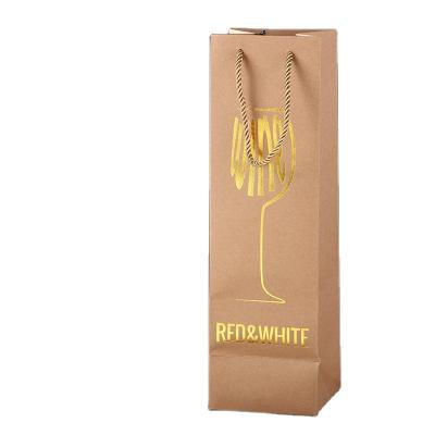 China Recycled materials wholesale cheap exquisite bronzing gold stamp wine bag kraft paper bag wine bag for sale