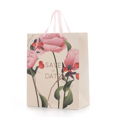 China Biodegradable Paper Gift Bags Floral Paper Gift Bags For Birthday Wedding Gifts for sale