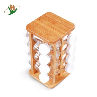 China Home Viable Freestanding Kitchen Storage Refills Bamboo Rotating Spice Rack with 16 Spice Glass Jars for sale