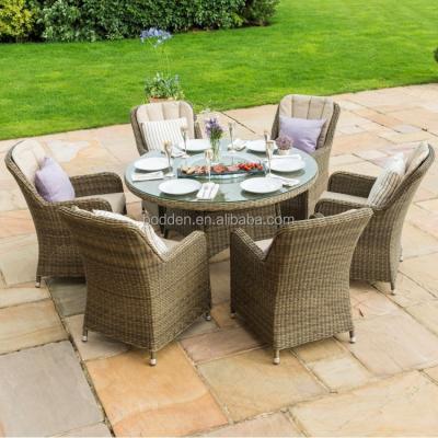 China Contemporary Labyrinth Design Rattan Furniture Round Table With 6 Chairs Patio Dining Set for sale