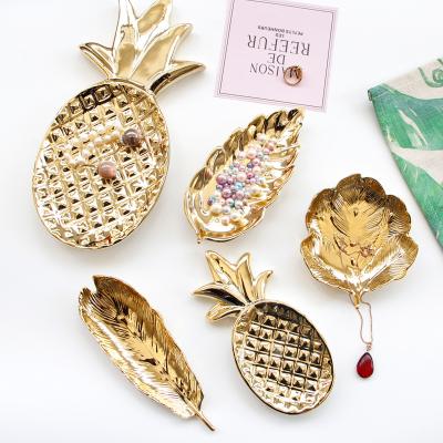 China Home Luxury Interior Decoration Pieces Tray Earrings Ring Storage Plate Ceramic Art Home Decor Luxury Gold Jewelry for sale