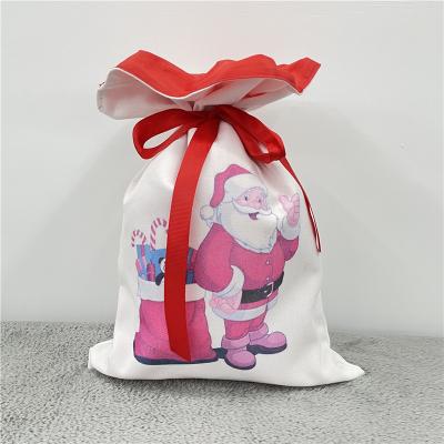 China 100% Empty High Quality White Polyester Christmas Stocking Drawstring Sublimation Canvas Santa Christmas Bags for sale