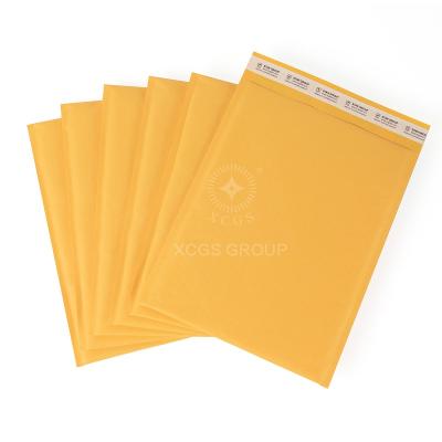 China Cost Effective Yellow Kraft Bubble Mailers Postage Bag Packaging Crash Resistance Mailer For Dilivery for sale