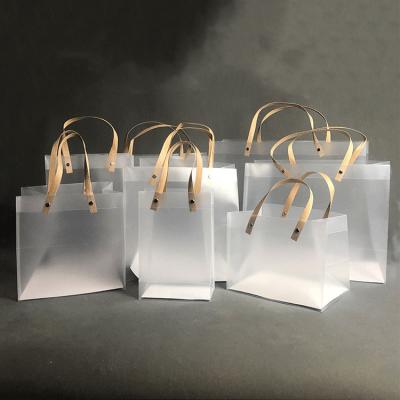 China Recyclable Christmas Custom Laminated Small Frosted Biodegradable Clear Tote Plastic Shopping Packing Bag With Logo for sale