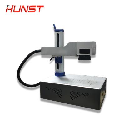 China Air-cooled high speed LOGO 20W date code portable fiber laser engraving machine, small laser marking machine for metal/plastic for sale