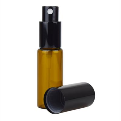 China High Quality Personal Care 3ml 5ml Amber Cylindrical Glass Oil Bottle With Black Cosmetic Spray Cap for sale