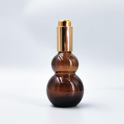 China Personal Care Wholesale 50ml Unique Design Amber Squash Shaped Essential Oil Dropper Customizable Logo for sale