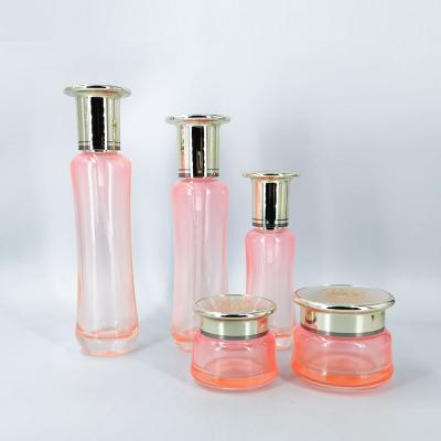 China Personal care cosmetics transparent pink glass package glass cream jar and lotion bottle set can be customized logo for sale