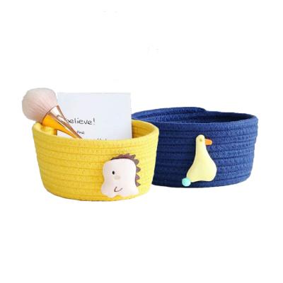 China Woven Tabletop Viable Storage Cotton Cartoon Basket Miscellaneous Cotton Storage Box And Finishing for sale