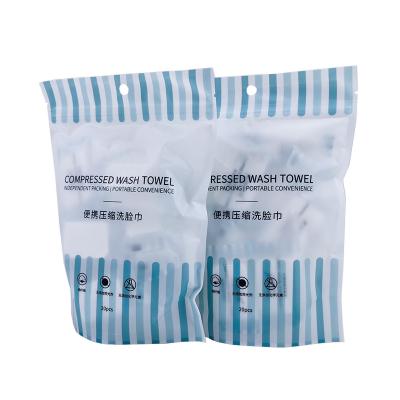 China Compressed Portable Compressed Face Towel Customized Packaging Bag Disposable Compressed Towel for sale