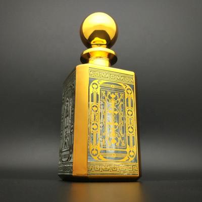 China Silver Etching Clear Glass Bottle 250ml 450ml Luxury Arabic Perfume Shiny Gold Bottle Display Personal Care Glass Bottle for sale