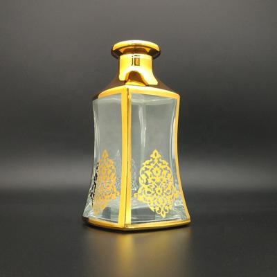 China UAE Bestseller Cosmetic Clear Empty Essence UV Decorated Bottle For Oud Oil Shop Display for sale