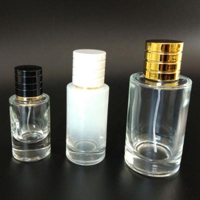 China 2021 Popular Personal Care Cylinder Glass Clear White Black Perfume Bottle 30ml 50ml 100ml With Mist Pump Spray for sale