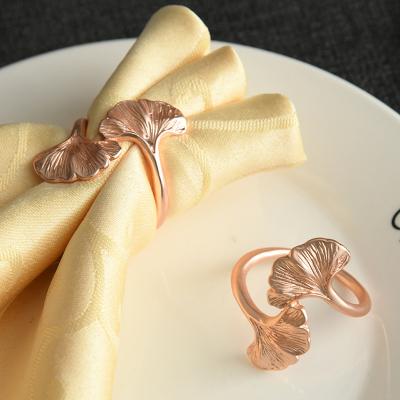 China Creative Viable Jachon Ginkgo Leaf Shape Napkin Ring Mounted Gold Alloy Napkin Ring Western Style Napkin Rings for sale