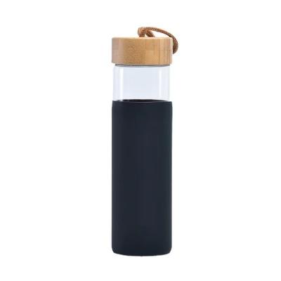 China New Design 500ml Borosilicate Glass Sustainable Water Bottle Custom Logo For Sport Travel With Bamboo Lid Encased Mention Strap Pink Black for sale