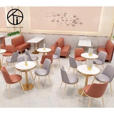 China Modern cafe dining table set dining table metal marble and gold chair with PU orange leather seat commercial restaurant furniture for sale