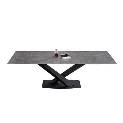 中国 Black Metal Space Saving Slate Rock Panel Contemporary Stylish Extendable 6 To 8 People Long Top Extendable Dining Table 販売のため