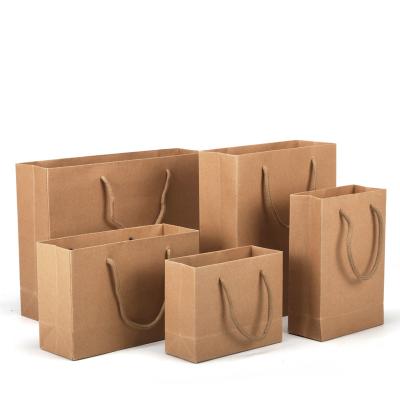 China Recycled Materials Customized Logo Take Away White Fashion Shopping Bag Brown Kraft Paper Bags for sale