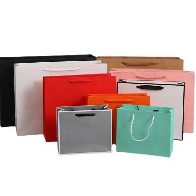 China Recycled Materials Wholesale Custom Printed Your Own Logo White Shopping Paper Bags With Ribbon Handles for sale