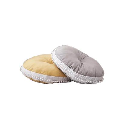 China Ultra Soft Anti Dust Baby Mite Round Floor Sofa Pillow With White Pom Poms Seating Cushion And Play Mat For Kids for sale