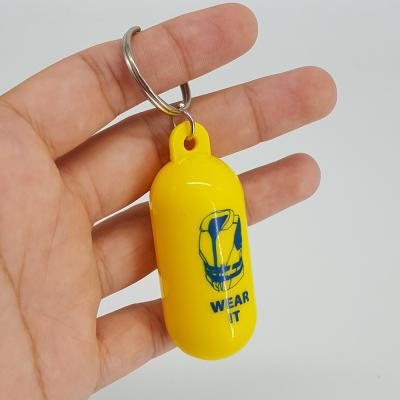 China Promotion Gift Custom To Add Yellow Color Capsule Style Logo Fender Shape Floating Keychain for sale