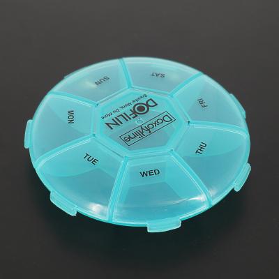 China Custom Portable Plastic Pill Storage Box Round Shape Weekly 7 Day Pill Storage Box Medicine Pill Case for sale