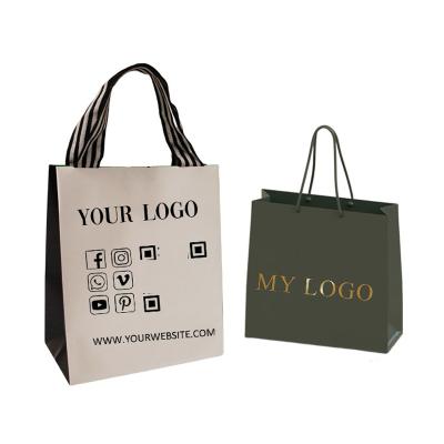 China Retail Carry Luxury Packaging Gift Paper Bag Logo Printed Cardboard Bolsas Shopping Custom Made Black Garment Biodegradable With Ribbon Handle for sale