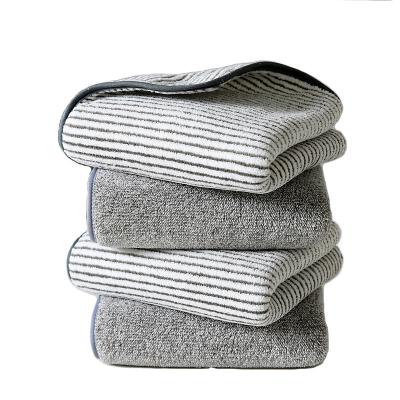 China Sustainable antibacterial coral bamboo charcoal fiber coral bath towel velor three piece combination set striped European and American beach towe for sale