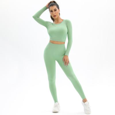 China Seamless knit backless high-stretch long sleeve yoga suit sports running fitness two-piece female suit for sale