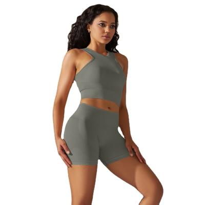 China Seamless knitted solid color tank top buttocks shorts yoga suit sports running fitness yoga dress woman for sale